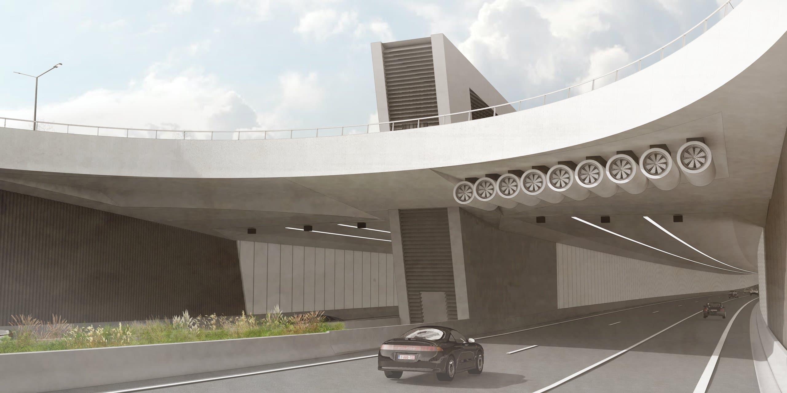 De tunnelventilatoren en trappartij onder het ronde fietsrondpunt, gezien vanaf de rijbaan