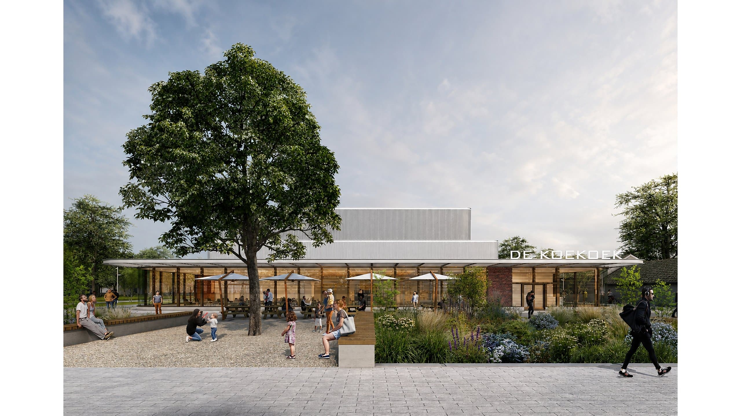 Impressie van het terras met parasols onder de grote boom, voor de cafetaria van De Koekoek
